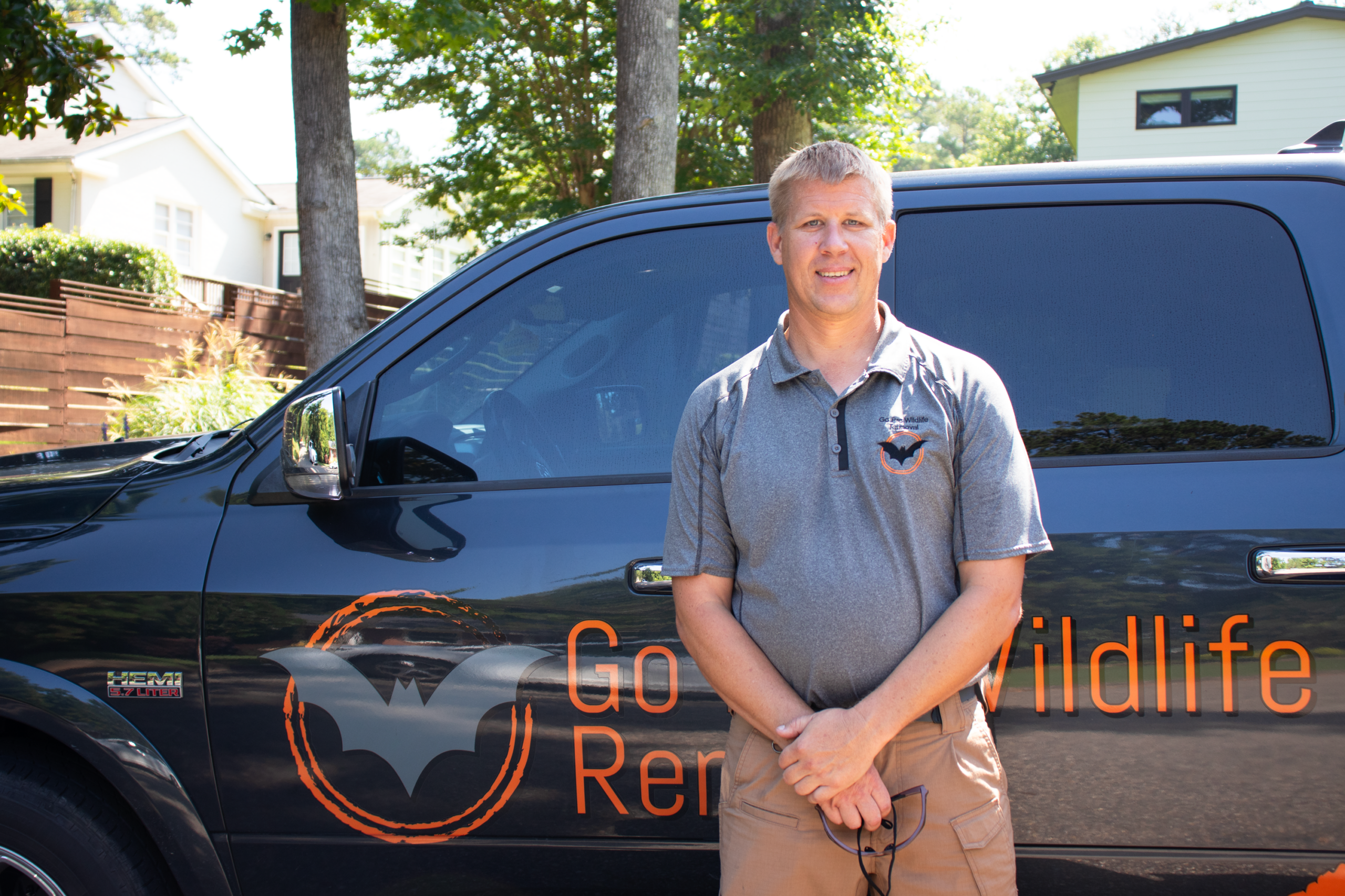 GOP_Headshot Man standing in front of Go Pro Wildlife Removal truck.